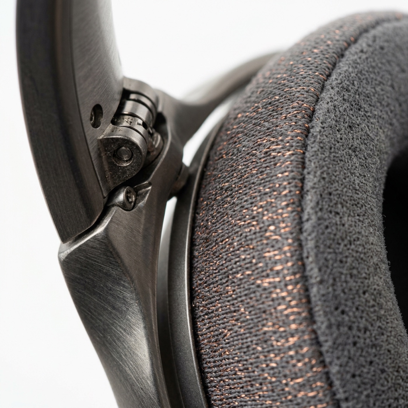 Close-up of the machined titanium hinge and copper-threaded merino ear cushion